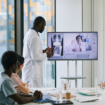 A medical team utilizing digital solutions for video conferencing
